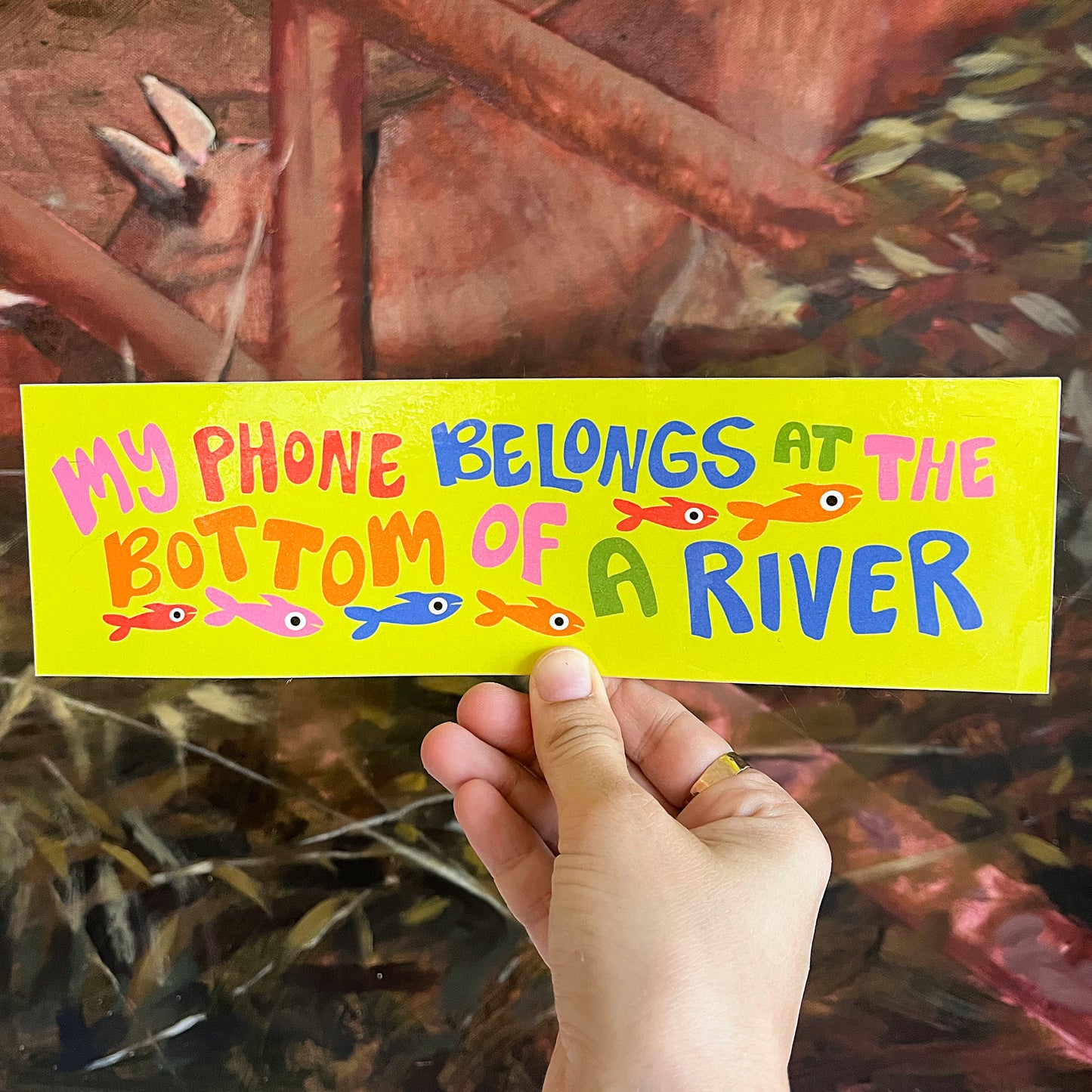 "My phone belongs at the bottom of a river" Bumper Sticker