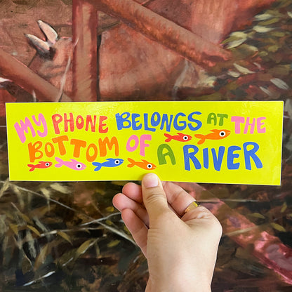 "My phone belongs at the bottom of a river" Bumper Sticker
