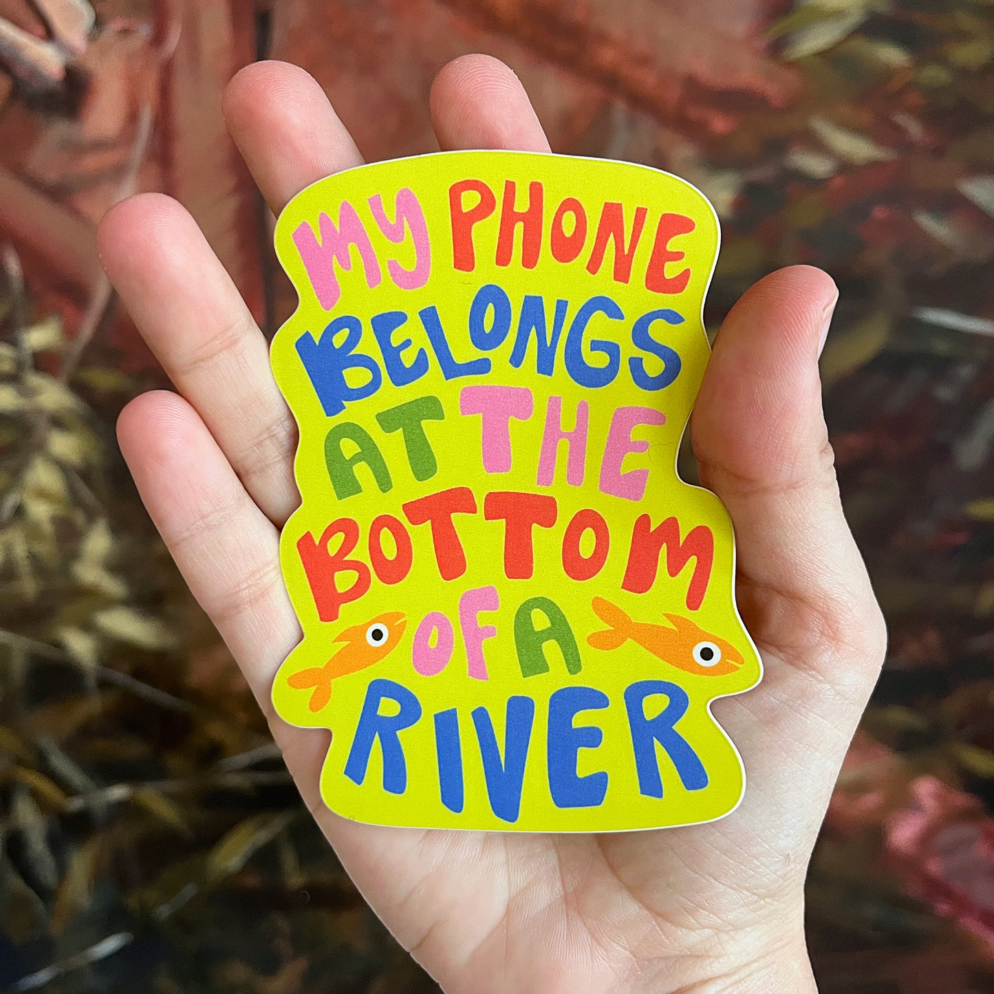 "My phone belongs at the bottom of a river" Sticker